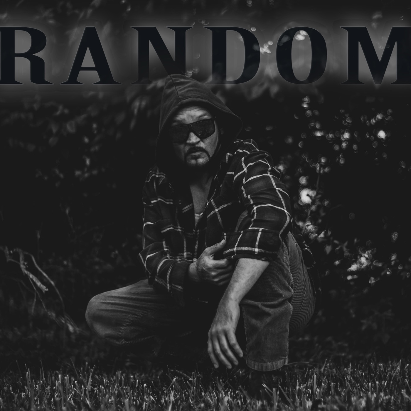 RANDOM EP cover: Timothy Chance crouched in tall grass, hood up, sunglasses, black and white, RANDOM across the top